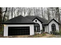 Two-story house with black and white exterior at 3541 Gleneagles Ct, Snellville, GA 30039