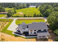 Luxury home with expansive driveway and modern design at 604 N Van Wert N Rd, Villa Rica, GA 30180