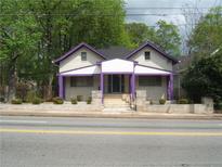 Charming two-story home with purple accents at 916 Metropolitan Sw Pkwy, Atlanta, GA 30310