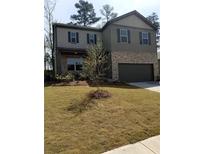 Two-story house with gray siding and a large yard at 405 Lake Ridge Ln, Fairburn, GA 30213