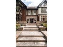 Grand entrance to a home with stone steps and landscaping at 1585 S Ponce De Leon Ave # M5, Atlanta, GA 30307