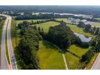 Aerial view of property, including pond and highway access at 831 Angham Rd, Hiram, GA 30141