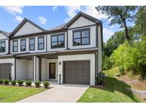 Two-story townhome with attached garage and modern exterior at 1321 Parc Bench Rd, Atlanta, GA 30316
