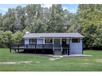 Newly renovated 1 story home with modern deck and landscaping at 497 Cook Rd, Oxford, GA 30054
