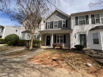 Two story townhome with gray siding and front yard at 709 Crestwell Sw Cir, Atlanta, GA 30331