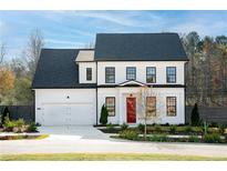 Two-story home with white siding, black trim, and a red front door at 428 10Th St, Auburn, GA 30011