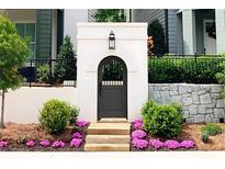 Stylish entryway with a gray door and stone accents at 110 Sheridan Ne Dr, Atlanta, GA 30305
