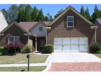 Brick house with two-car garage and manicured lawn at 2816 Staunton Dr, Duluth, GA 30097