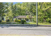Ranch style home with mature trees and landscaping at 2472 Perry Nw Blvd, Atlanta, GA 30318