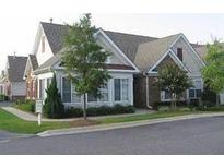 Inviting exterior of charming brick home with mature landscaping at 6133 Malloway Ct, Cumming, GA 30041