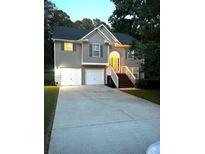 Two-story house with a two-car garage and a landscaped yard at 3364 Joseph Nw Dr, Acworth, GA 30101