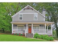 Charming two-story house with a gray exterior and porch at 3483 Conley St, College Park, GA 30337