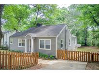 Charming house exterior with picket fence and landscaping at 1902 Canterbury St, Decatur, GA 30032