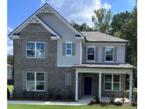 Two-story home with gray siding and brick accents at 558 Abbott Se Ct, Atlanta, GA 30354