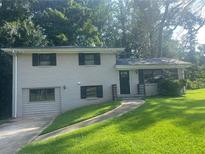 Charming ranch home with a well-maintained lawn at 1870 Glen Echo Dr, Decatur, GA 30032