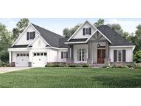 Stunning farmhouse exterior with a large front yard at 542 Little Vine Church Rd, Villa Rica, GA 30180