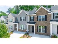 Three townhouses with gray and brown brick exteriors at 4282 Cullum Ct # 37, Decatur, GA 30034