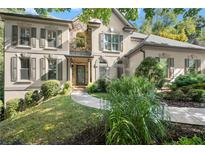 Stunning two-story home with stone accents and manicured landscaping at 3300 Millwater Xing, Dacula, GA 30019