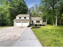 Charming house with a three-car garage and a deck at 2140 Fern Valley Sw Dr, Atlanta, GA 30331