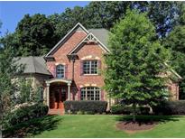 Brick house with a large front yard and landscaping at 319 Summer Garden Dr, Marietta, GA 30064