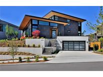 Modern home with sleek design and attached garage at 4814 Neal Rdg, Atlanta, GA 30349