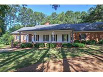 Brick ranch house with a large front porch at 45 Latimer Nw Ln, Cartersville, GA 30121
