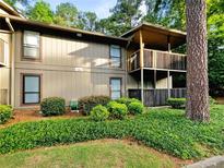 Condo exterior with balcony and landscaping at 707 Cumberland Se Ct, Smyrna, GA 30080