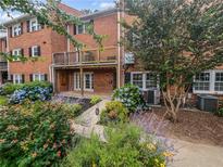 Brick patio with access to the unit and surrounded by beautiful landscaping at 6520 Roswell Rd # 68, Atlanta, GA 30328