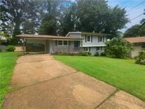 Ranch style home with carport and landscaped yard at 2492 Brentwood Ct, Decatur, GA 30032