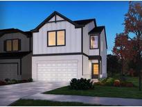 Two-story house with white and black exterior at 1600 Flint River Place Se Se Pl, Smyrna, GA 30126