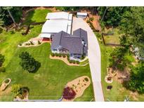 Aerial view of home, detached garage, and large backyard at 84 Ledbetter Rd, Villa Rica, GA 30180