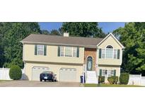 Two-story house with two-car garage and landscaped yard at 1620 Cedar Hl, Douglasville, GA 30134