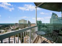 Spacious balcony with city views and small table and chairs at 3324 Peachtree Ne Rd # 2718, Atlanta, GA 30326