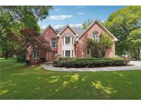 Brick house with landscaped lawn and walkway at 21 Sherman Nw Ln, Cartersville, GA 30121