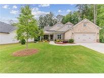 Charming craftsman style home with a two car garage at 105 Summerlin Dr, Canton, GA 30115