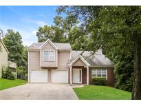 Two-story house with two-car garage and landscaped lawn at 4245 Brandy Ann Dr, Acworth, GA 30101