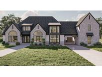 Stunning two-story home with stone exterior, large windows, and a three-car garage at 1547 Adora Ln, Duluth, GA 30097