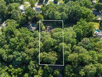 Aerial view showing home nestled in a wooded area at 4872 Northland Dr, Atlanta, GA 30342