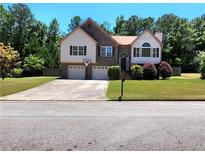 Ranch home with two-car garage and large yard at 6561 Harrington Pl, Douglasville, GA 30135