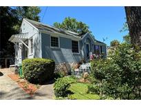 Charming ranch home with gray exterior and landscaping at 2054 Marco Dr, Decatur, GA 30032