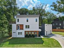 Modern two-story home with a three car garage at 1940 Fellowship Rd, Tucker, GA 30084