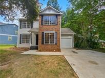 Brick two-story home with attached garage at 2110 Glenwood Downs Dr, Decatur, GA 30035
