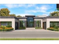 Modern home exterior with dark brick, large windows, and a flat roof at 1807 Trinidad, Stockbridge, GA 30281