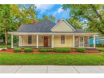 Charming yellow house with a front porch at 1068 N Main Nw St, Conyers, GA 30012