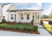 Charming craftsman style home with front porch and landscaping at 499 Godfrey Dr, Cumming, GA 30040