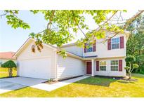 Two-story house with attached garage and manicured lawn at 3139 Redwood Run, Atlanta, GA 30349