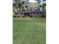 Brick ranch house with a large grassy front yard at 4193 Dunmore Rd, Decatur, GA 30034
