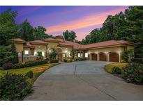 Mediterranean style home with three car garage at 1608 Golden Creek Sw Ct, Conyers, GA 30094