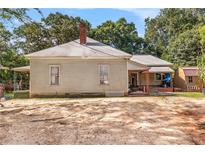 Older home with a large yard and outbuildings at 4115 Hicks Rd, Austell, GA 30106