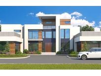 Modern house exterior with a sleek design and driveway at 1805 Trinidad, Stockbridge, GA 30281